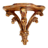 Golden wood wall console in Louis XV style.