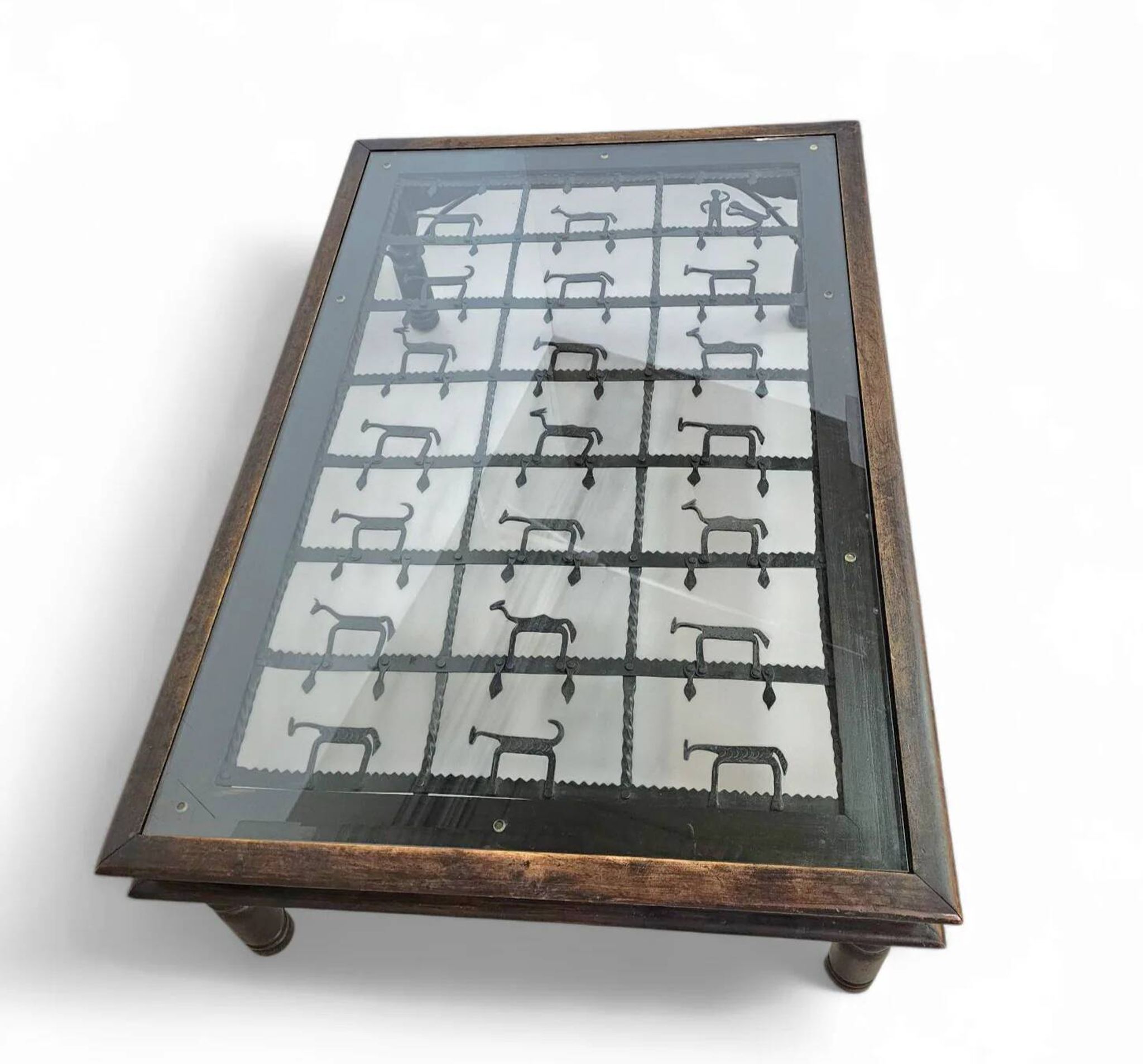 French brutalist coffee table, forged wrought iron, shepherd with dog and his herd, 1970s, transparent glass top