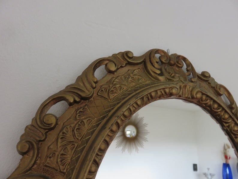 Golden baroque oval mirror, 60s-70s