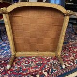 Golden wooden bergère in Louis XVI style upholstered in Bordeaux velvet.