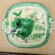 Old square plate in slipware with plant decoration.