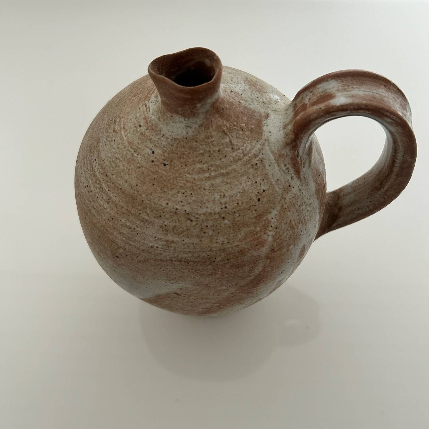 Patinated stoneware jug
