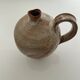 Patinated stoneware jug