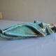 Surreal ceramic sculpture in relief signed to be identified.