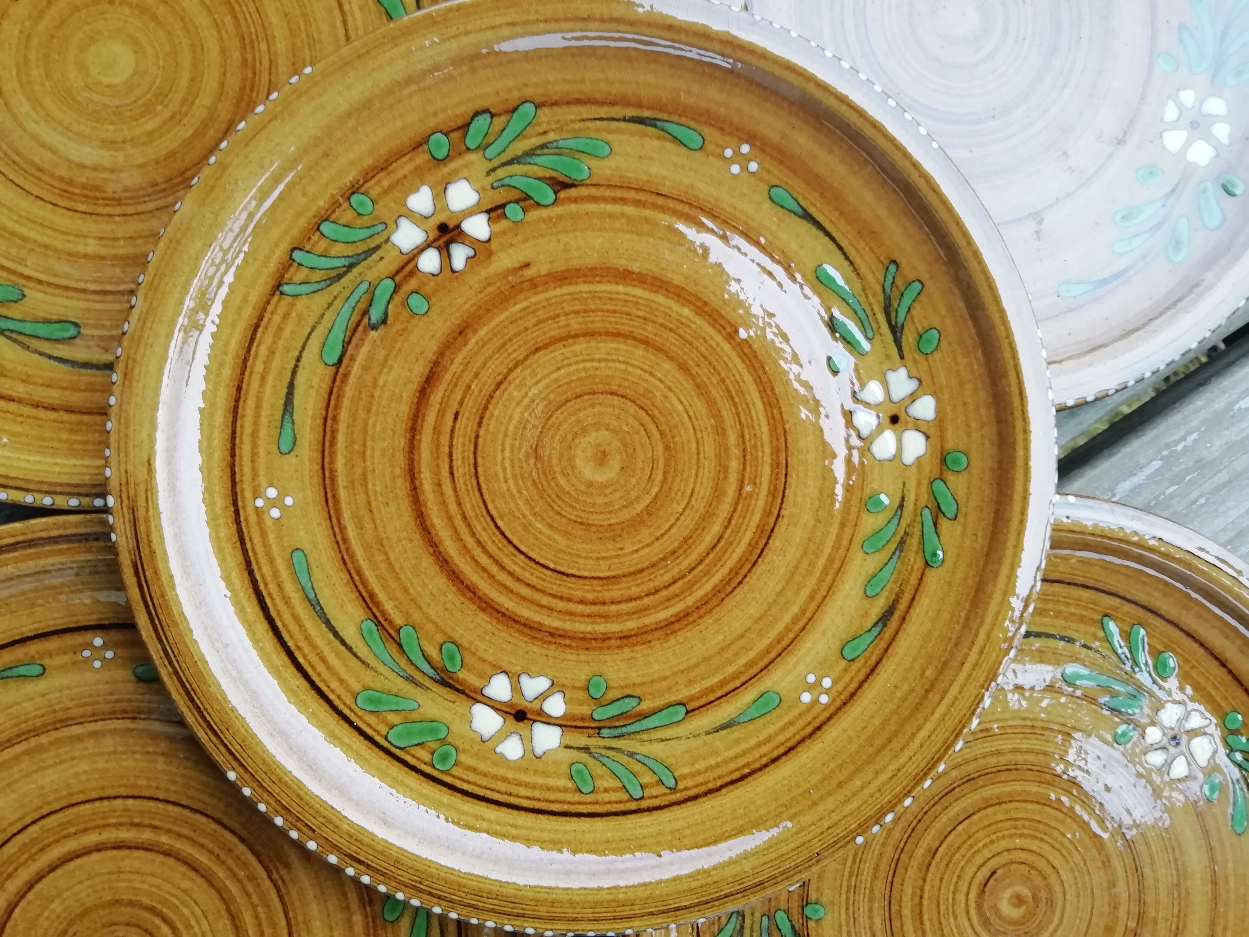 Set of glazed ceramic plates