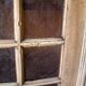 Glass-fronted cabinet from 1915, solid wood.