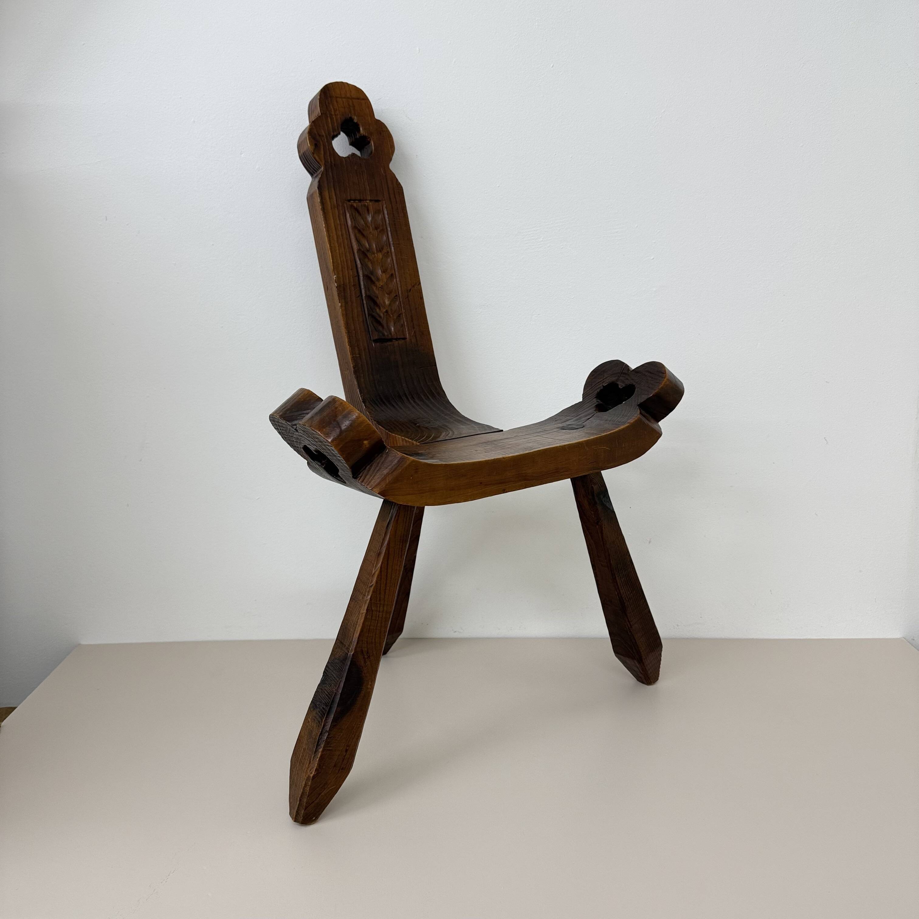 Brutalist hand carved oak Spanish tripod chair , 1970s