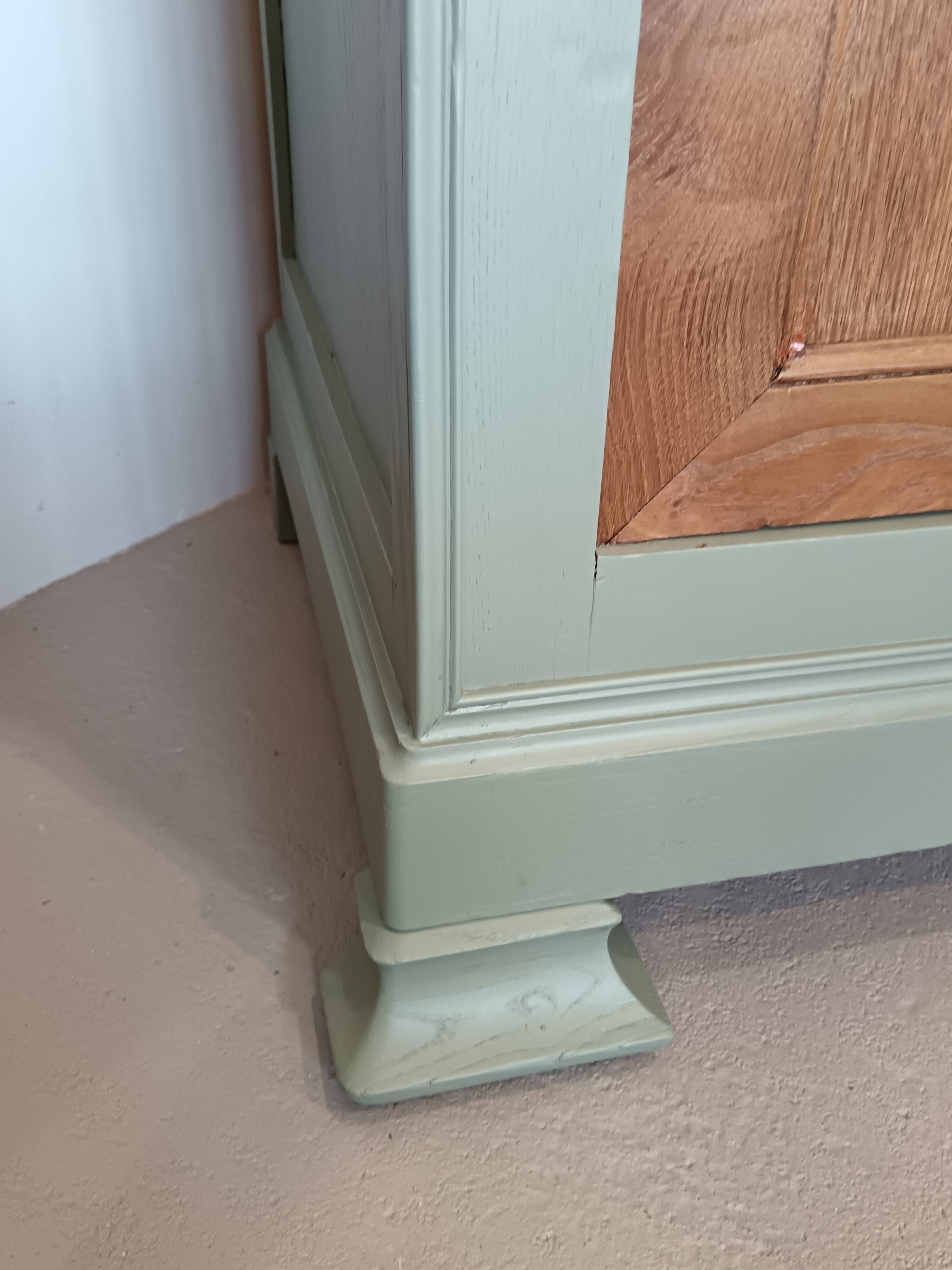 Buffet made of natural wood and bronze green.