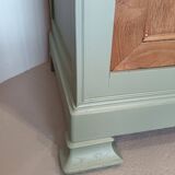 Buffet made of natural wood and bronze green.