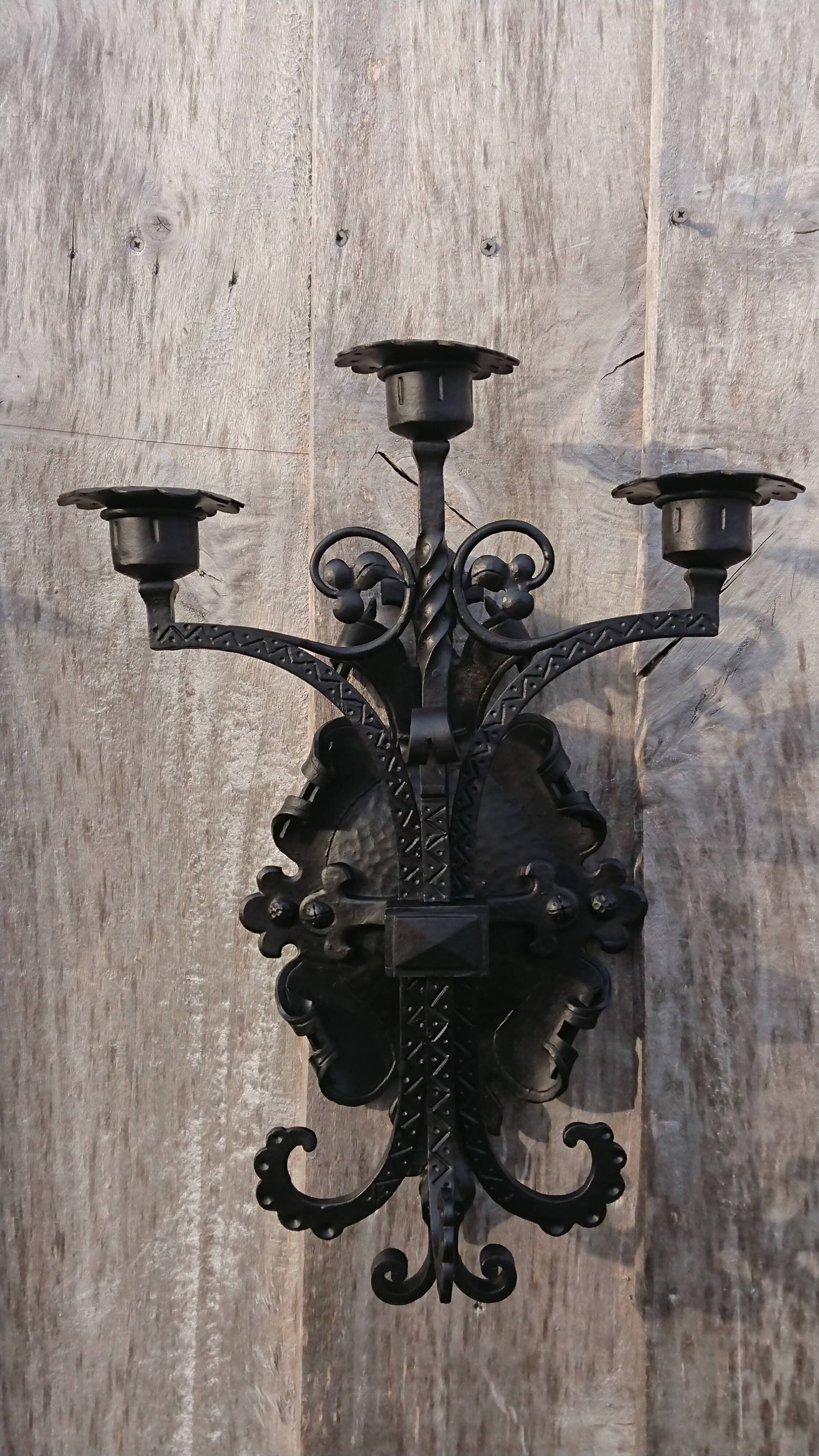 Pair of black wrought iron sconces - neo-Gothic style - from the 1950s
