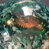 Design bookends in fractal resin with watchmaking inclusions.