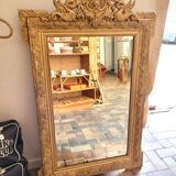 Old gilded mirror with pediment