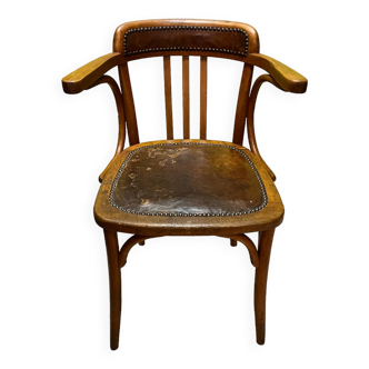 Old curved wood and leather office armchair early 20th century