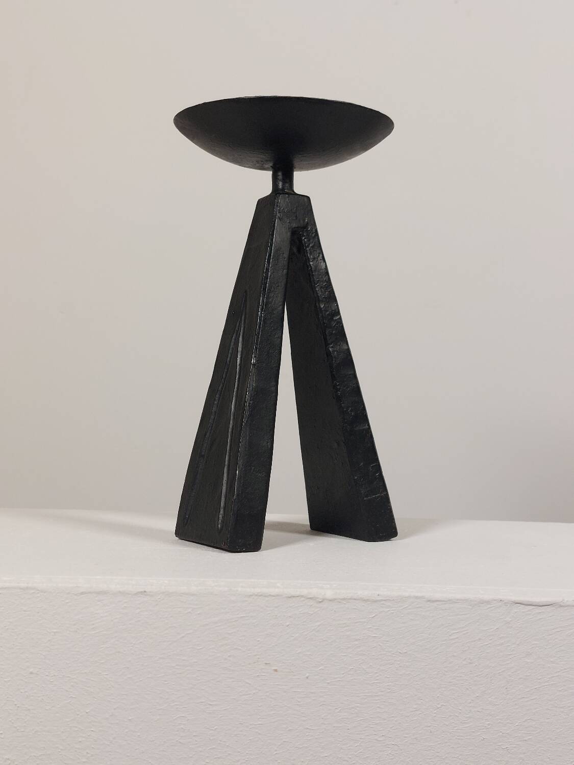 Vintage candle holder made of hand-forged metal, in a brutalist style.
