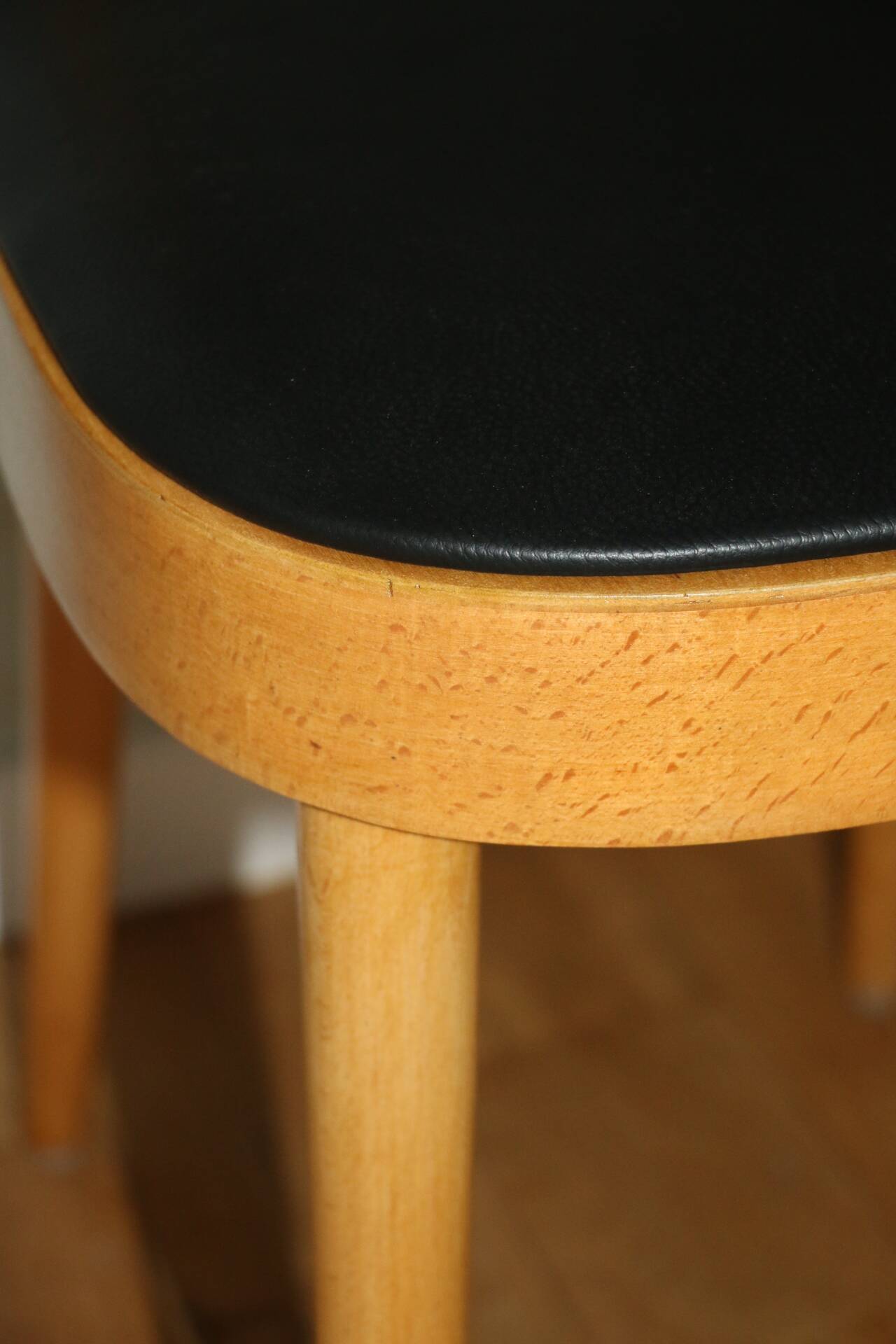 5 baumann chairs with large backs in black faux leather.