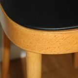 5 baumann chairs with large backs in black faux leather.