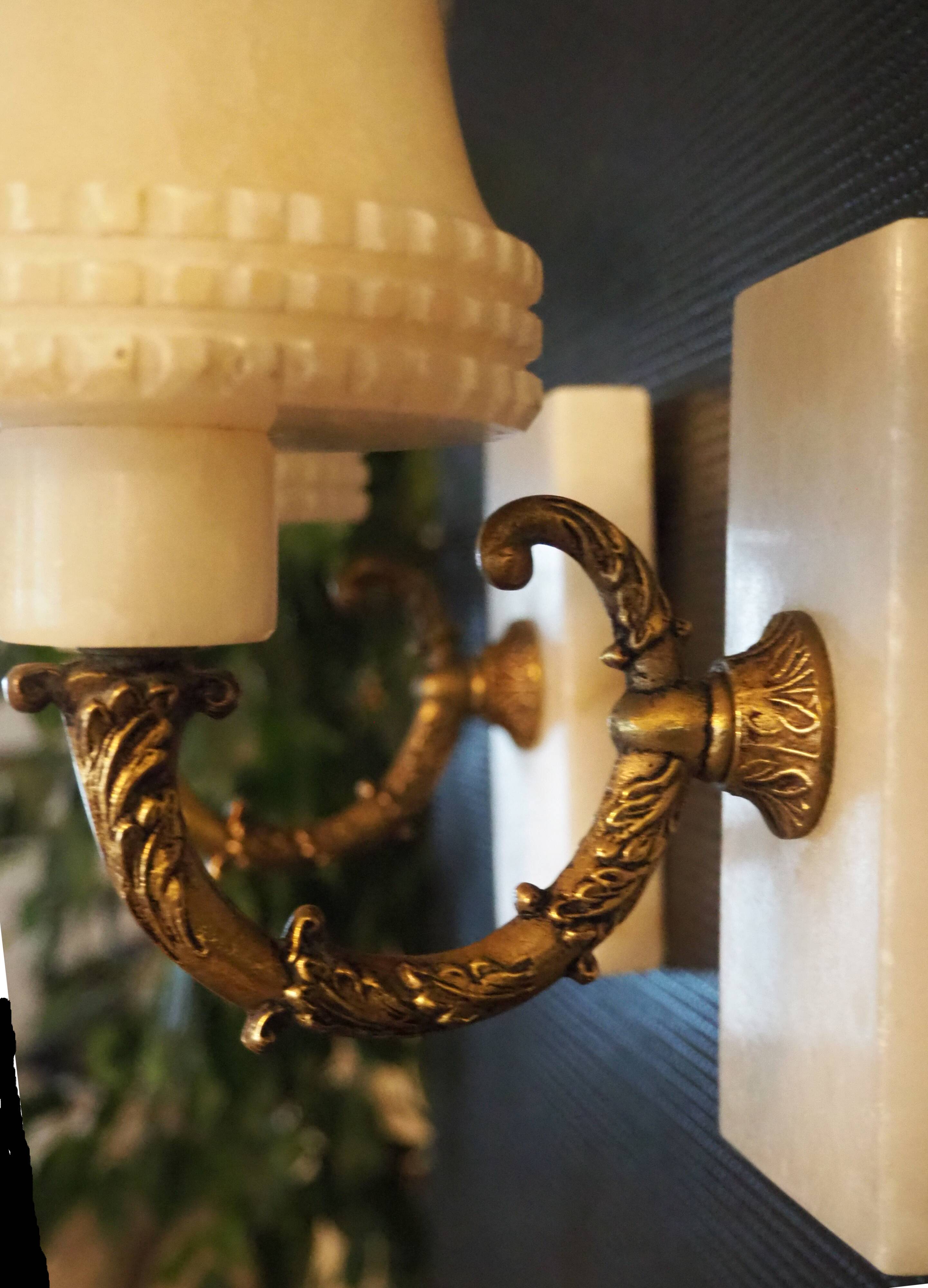 Pair of curved alabaster and bronze appliques