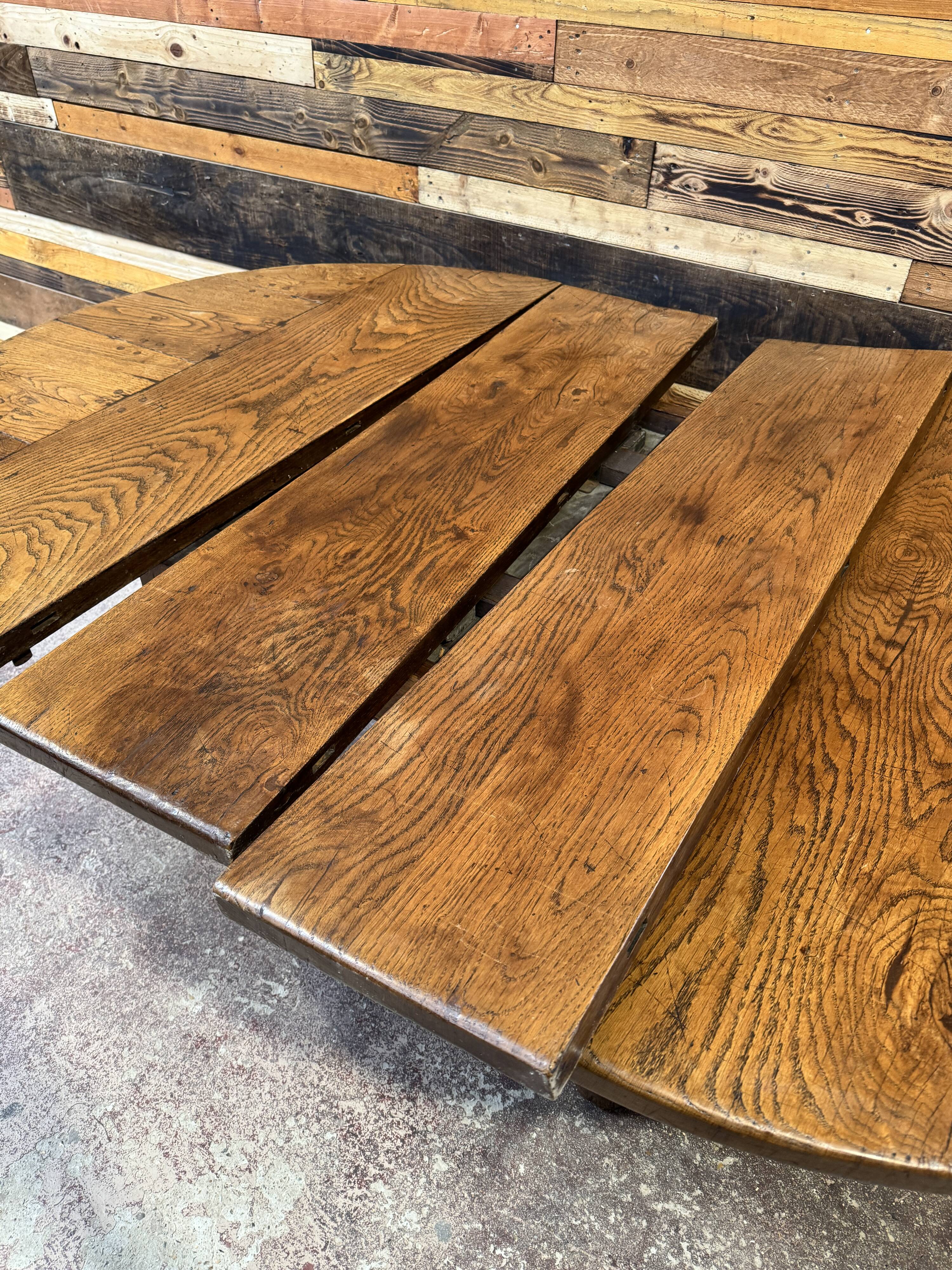 Antique oak round table with extensions, beautifully made from the years.