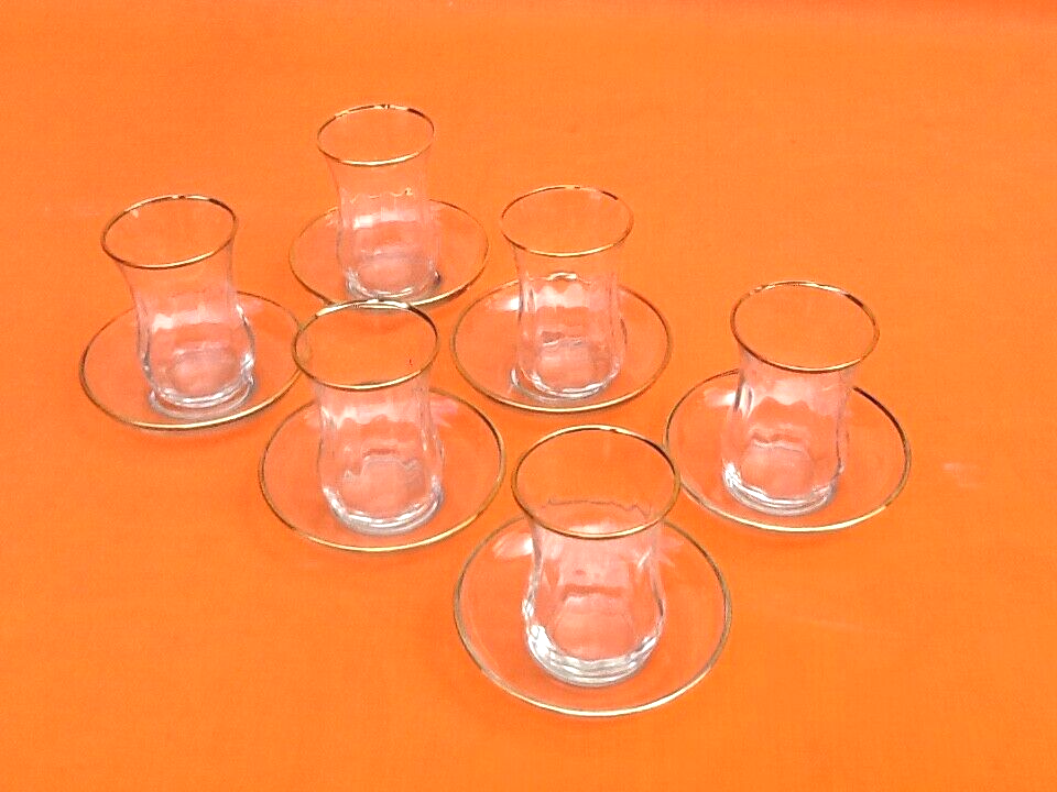 Transparent glass tea service with gilding.