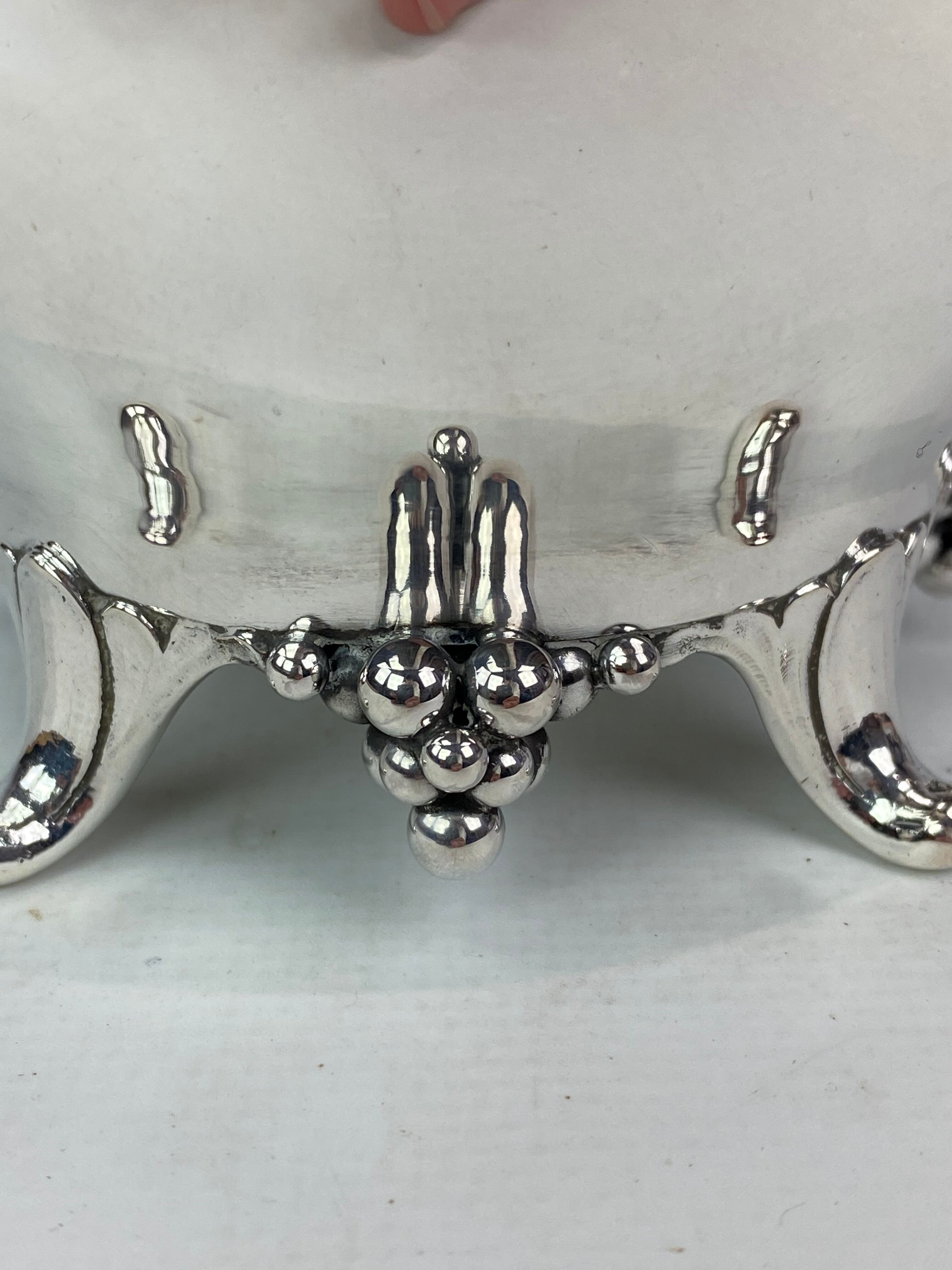 Water jug on feet decorated with ebony of hallmarked silver from the 1940s. The jug is in great anti