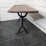 Table de bistrot pieds en fonte dessus en bois massif