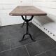 Bistro table with cast iron legs and solid wood top