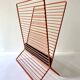 Wire metal magazine rack with triangular compartment, 1950s.