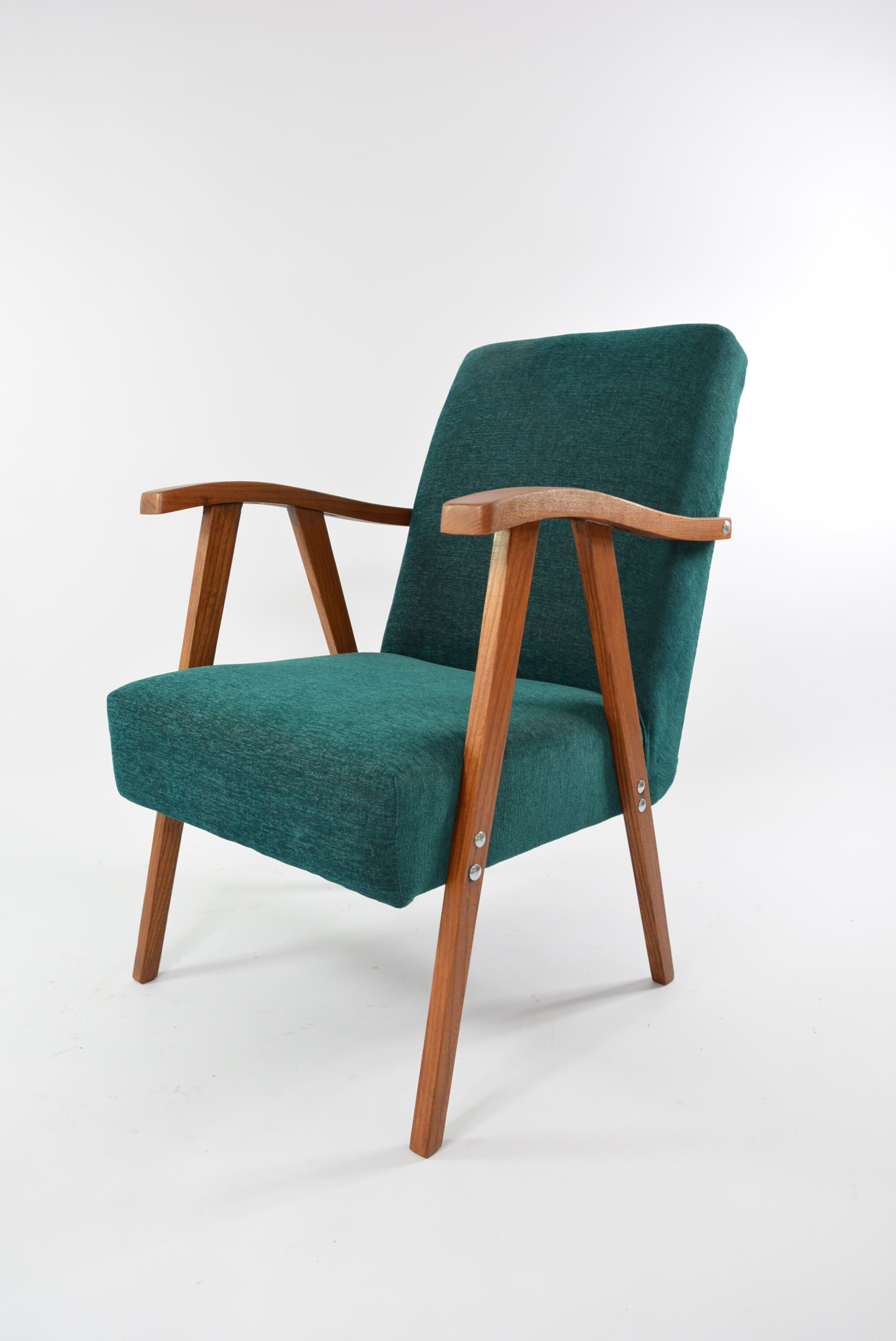Green curved armchair