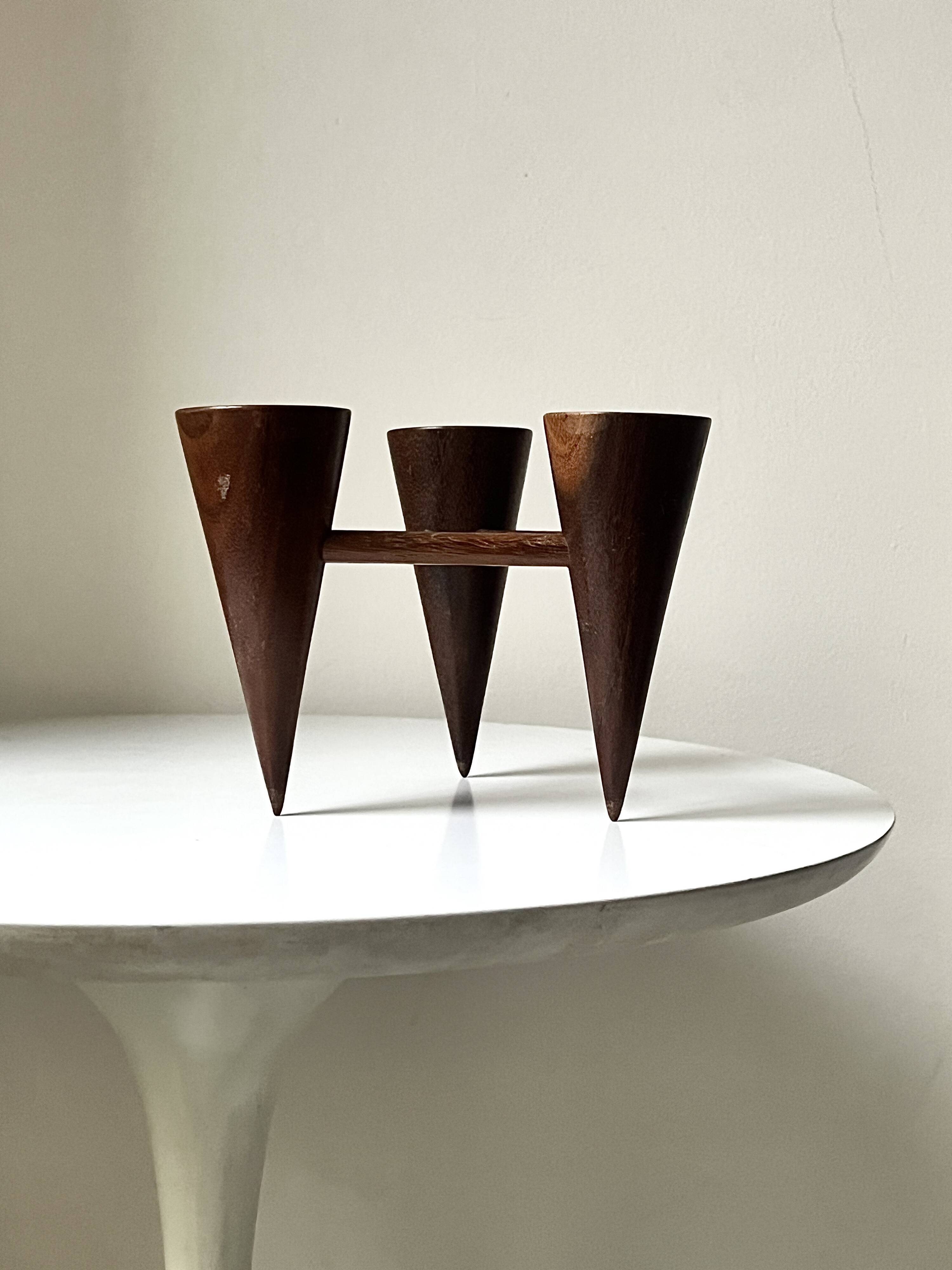 Scandinavian tripod candle holder in carved wood, design from around 1970.