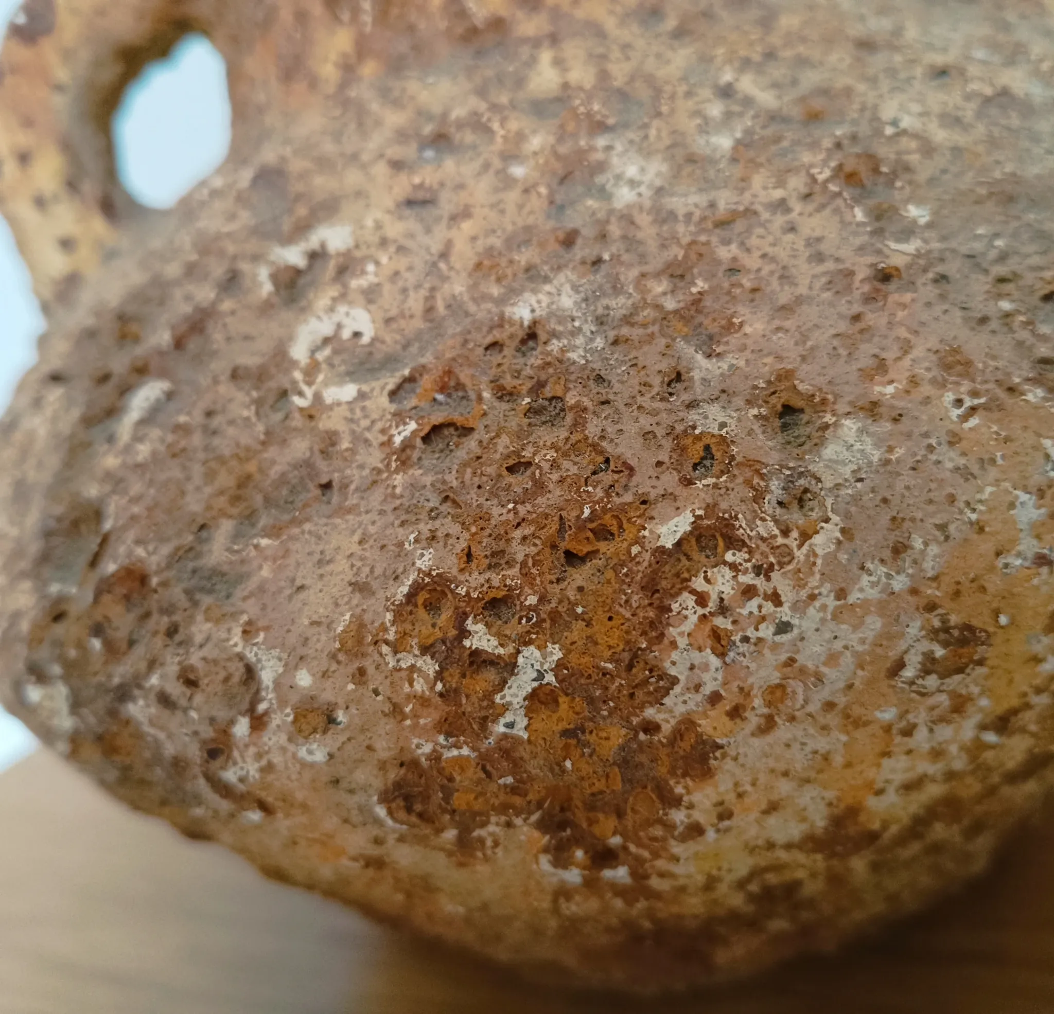 Textured terracotta vase in wabi-sabi style