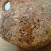 Textured terracotta vase in wabi-sabi style