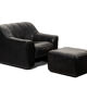Maison De Sede. Armchair and its ottoman in black leather. 1970s.