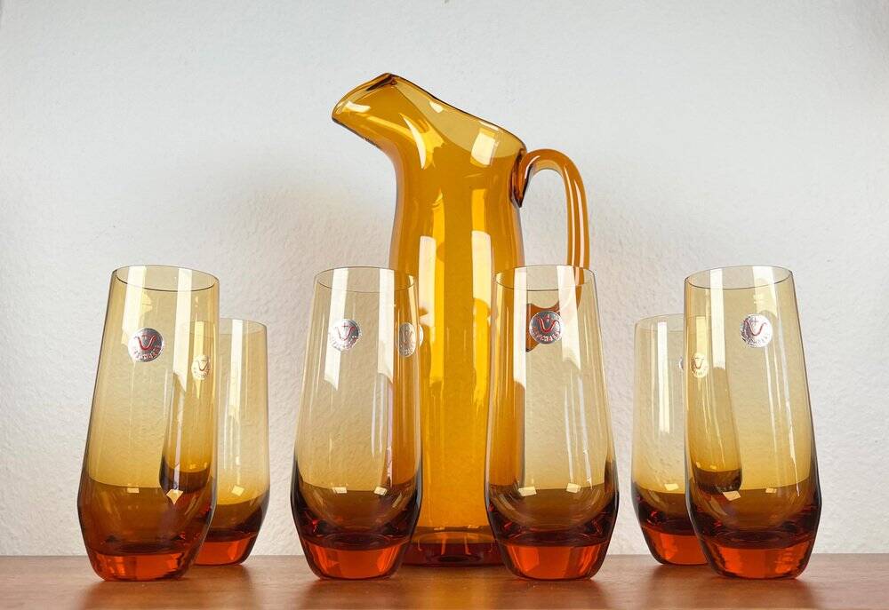 Amber glass carafe from the mid-century German Jagdhaus series and drinking glasses by Wilhelm Braun-Feldweg for Hirschberg, 1960s, set of 7.