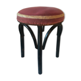Black stool sitting in velvet rose
