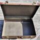 Brown vintage suitcase with CHENEY England brand travel tags