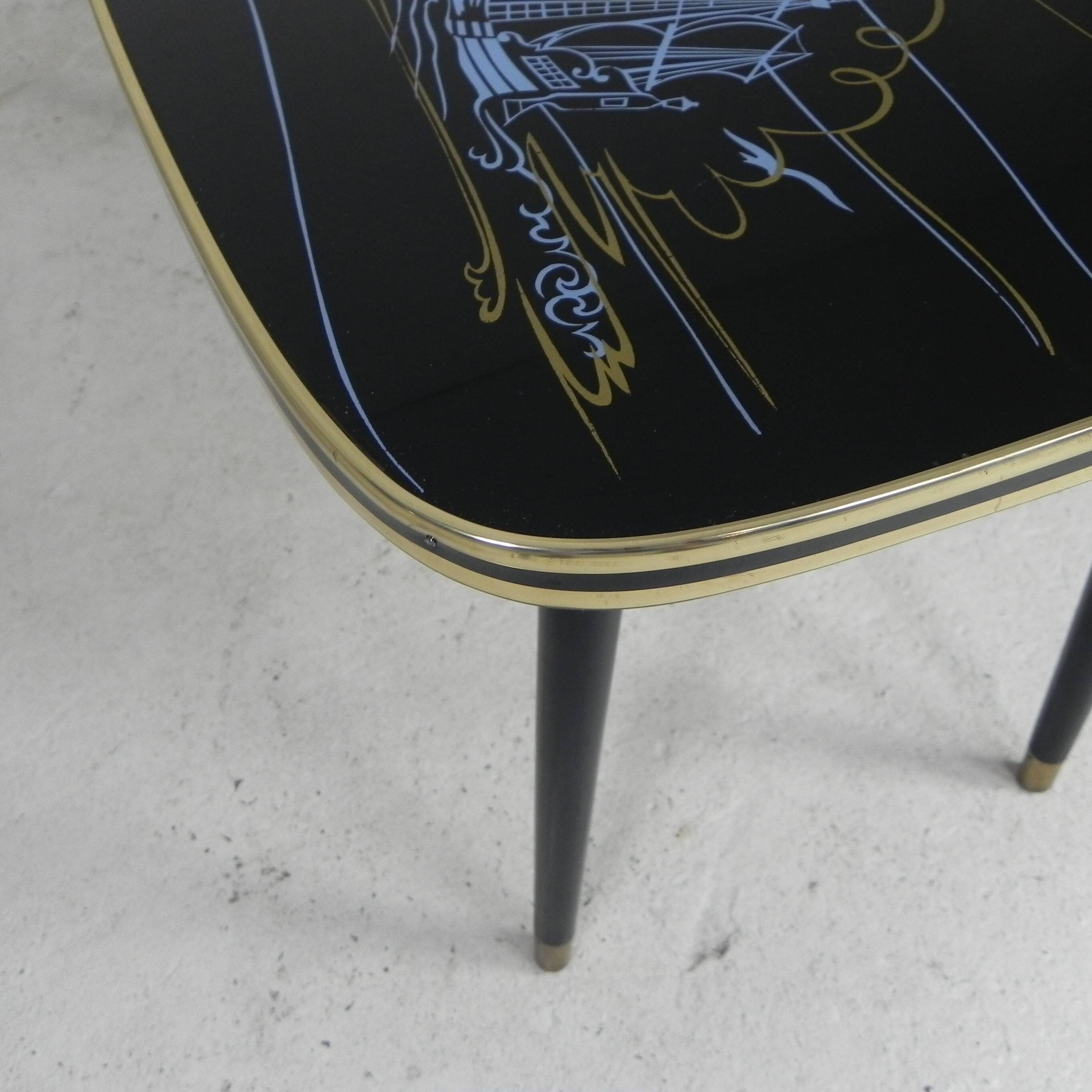 Vintage coffee table with glass top and angled legs