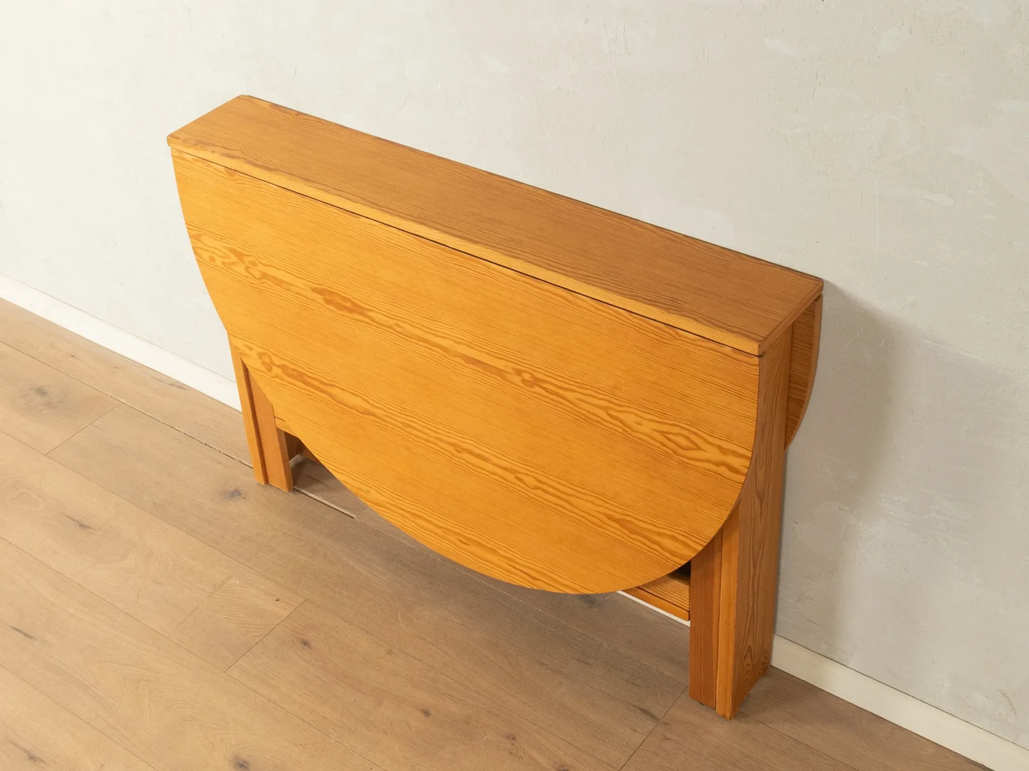 Practical folding table from the 1980s made of light brown pine wood