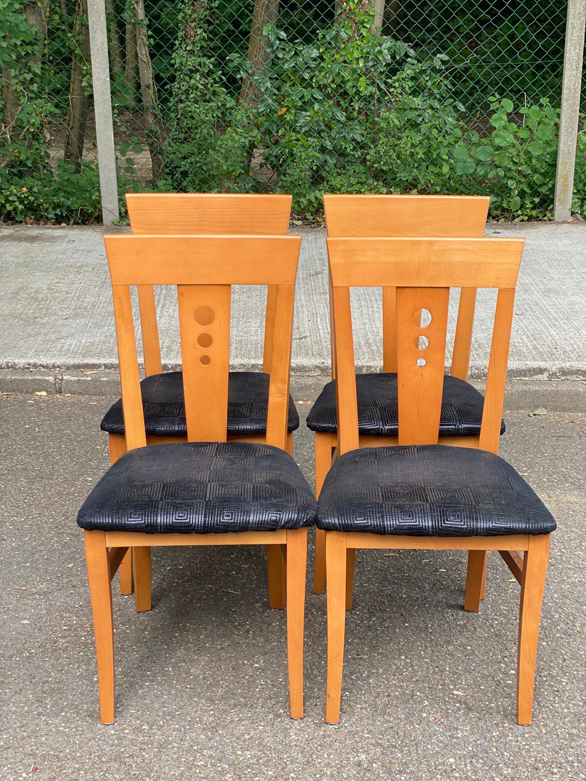 4 Scandinavian dining chairs in solid wood and black fabric from the 1990s.