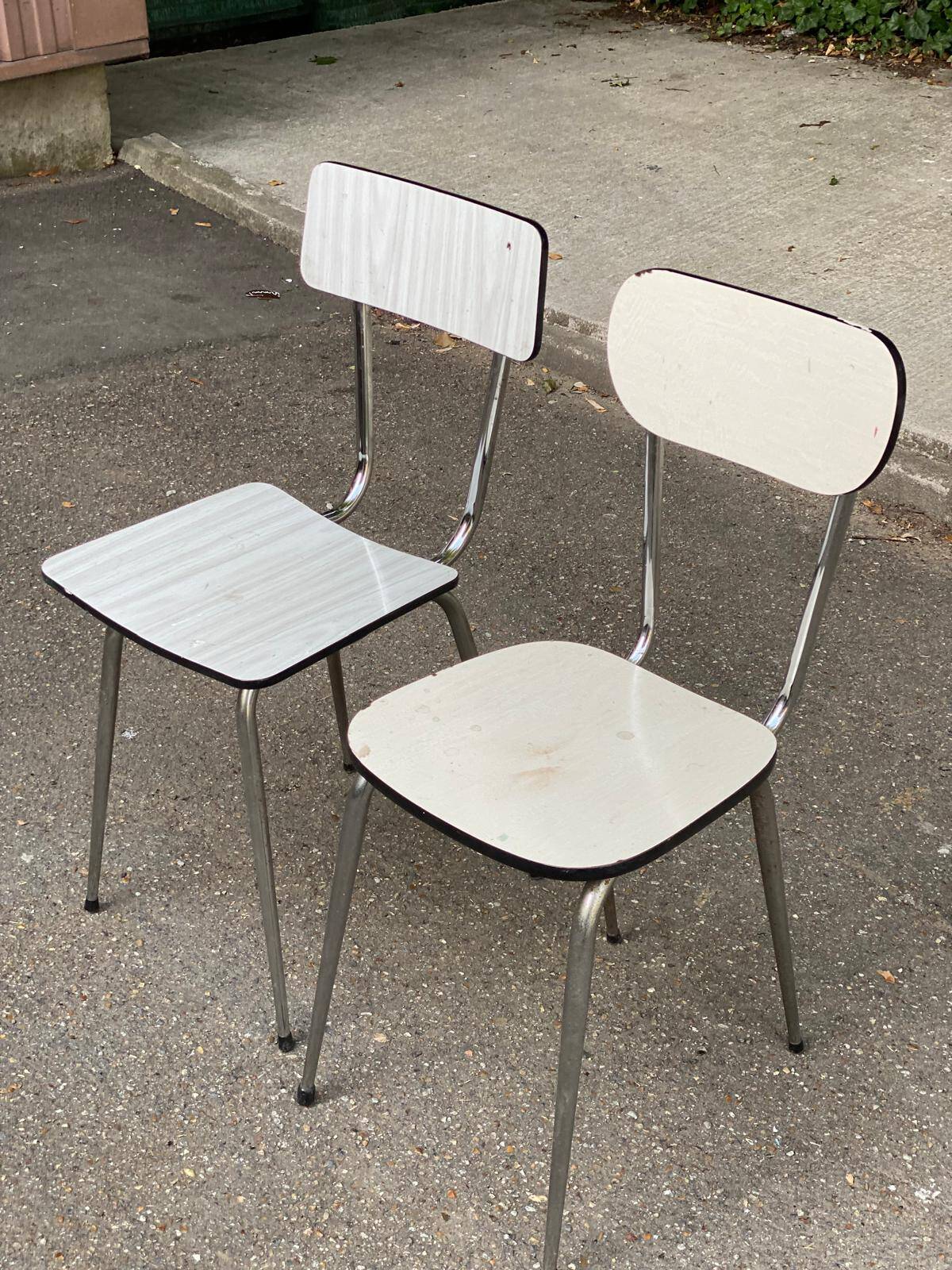 2 beige formica and steel chairs
