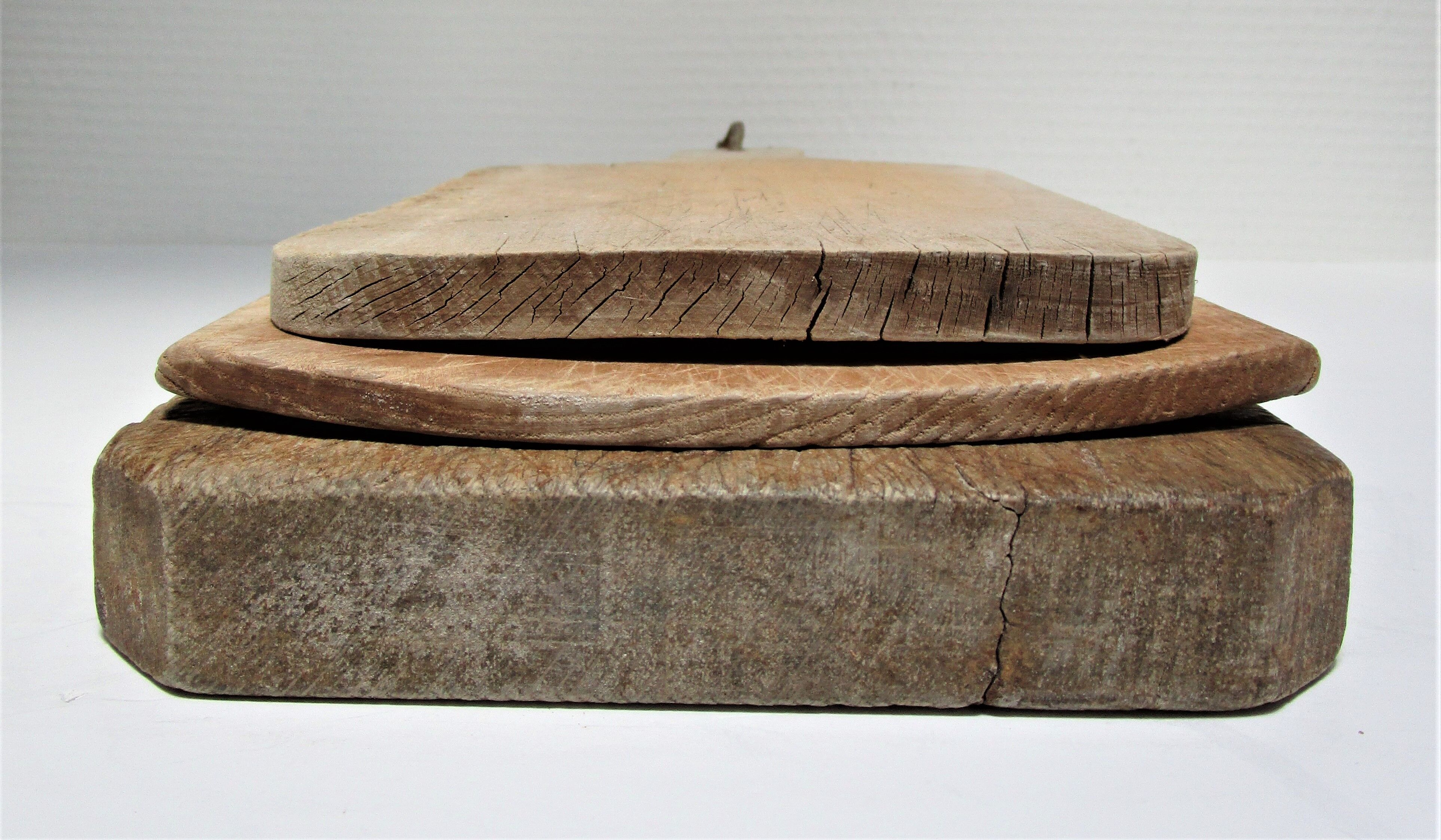 three vintage patinated solid wood cutting boards