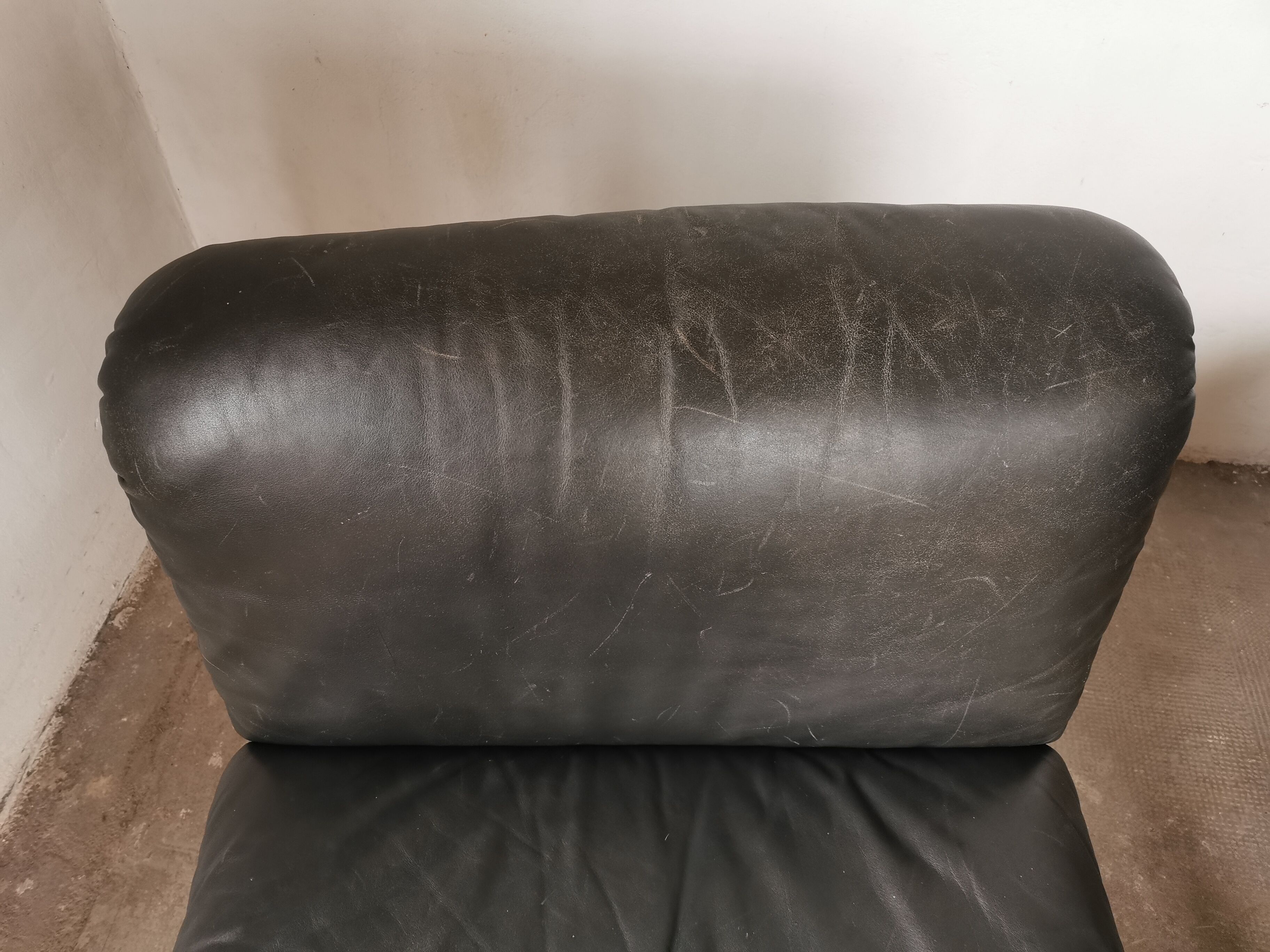 Pair of designer leather armchairs 80s