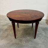 Extendable mahogany round table in Louis XVI style