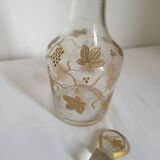 Old crystal carafe with golden decoration