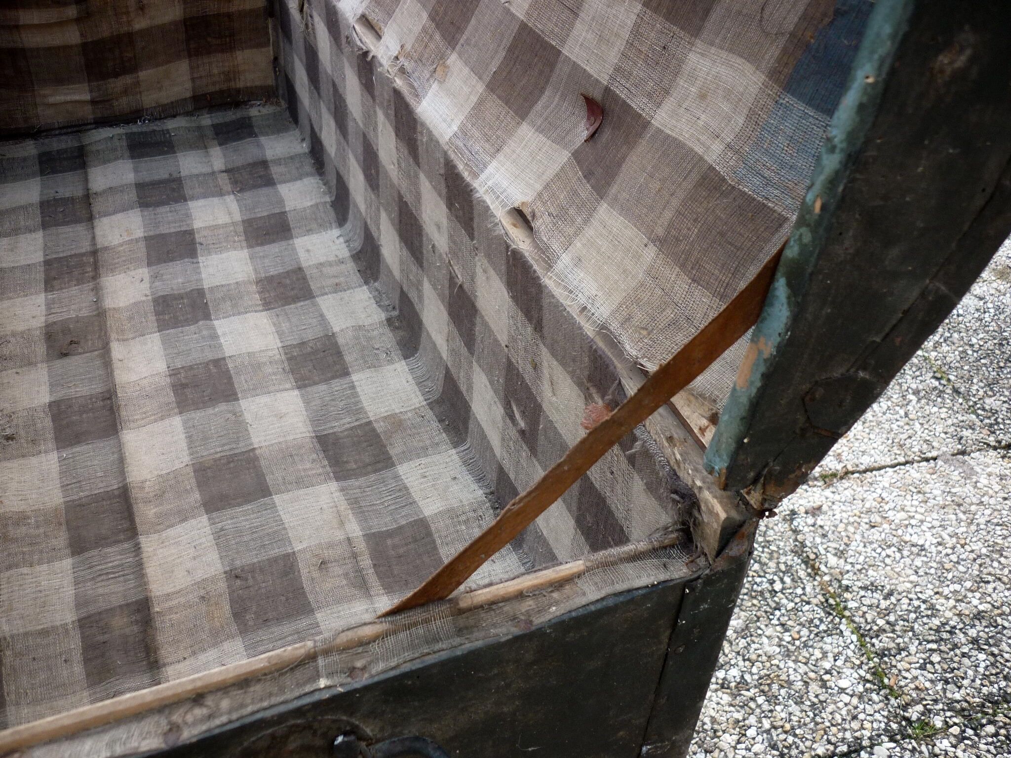 Old bulging wooden travel trunk