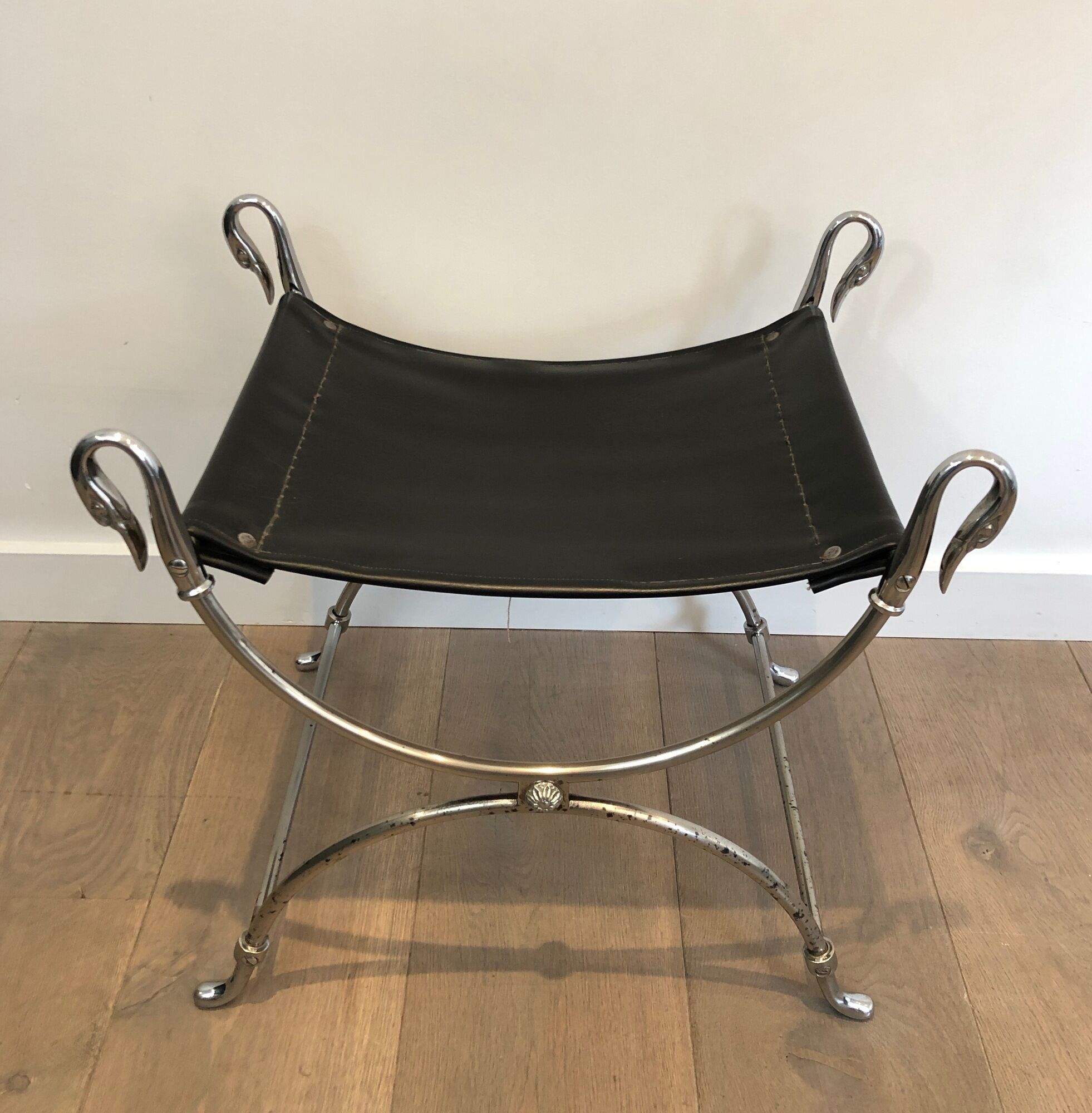 Curule stool in silver steel neoclassical style with swan heads