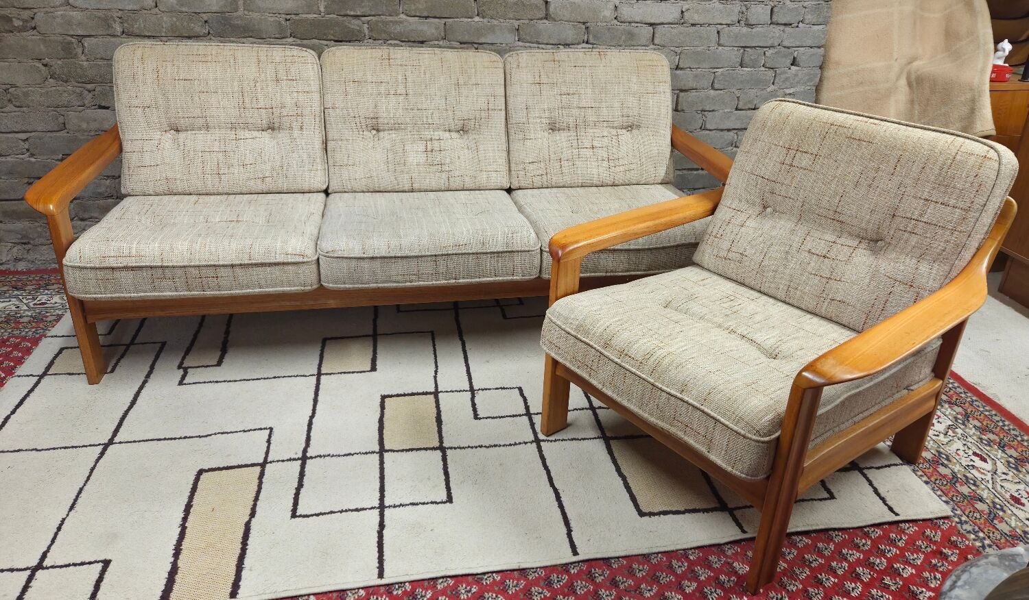 Danish canapé and its 1970s teak armchair