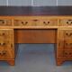 Vintage satin wood partner desk with leather top.