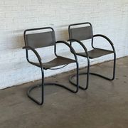 Vintage cantilever lounge chairs — pair, grey leather and tubular steel