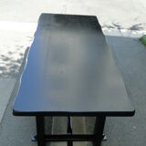 Black black brutalist table in elm