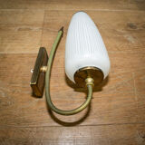 Ornate wall lamp made of milk glass and brass